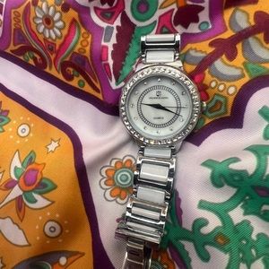 Ostrich King rhinestone stainless steel water resistant fashion watch.